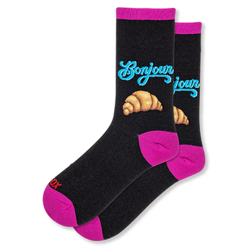 Black crew socks with blue Bonjour script above a croissant graphic, featuring hot pink accents on the heels and toes.