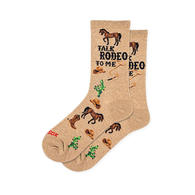 Tan crew socks with the text TALK RODEO TO ME, patterned with brown horses, cowboy hats, lassos, and green cacti.