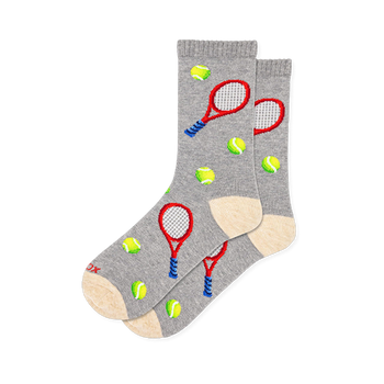 Grey crew socks patterned with red tennis rackets, neon green balls, and cream-colored heels and toes.