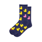 Dark navy blue crew socks featuring a pattern of yellow rubber ducks with orange beaks and one bright pink rubber duck.