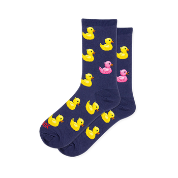 Dark navy blue crew socks featuring a pattern of yellow rubber ducks with orange beaks and one bright pink rubber duck.