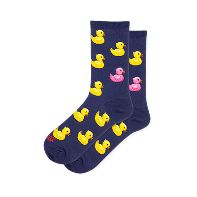 Dark navy blue crew socks featuring a pattern of yellow rubber ducks with orange beaks and one bright pink rubber duck.