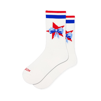 White active crew socks featuring red and blue athletic stripes at the cuff and a red star graphic topped with a blue bow.