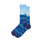 Light blue crew socks featuring dark blue rolling ocean waves on the bottom half and a small orange sailboat on the horizon.