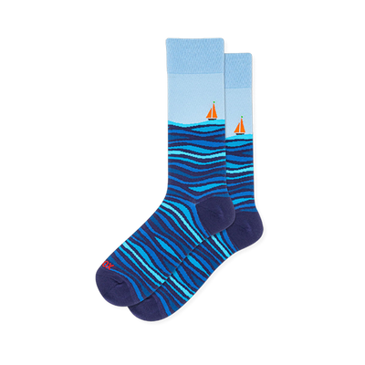 Light blue crew socks featuring dark blue rolling ocean waves on the bottom half and a small orange sailboat on the horizon.