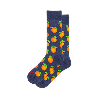 Heather navy blue crew socks covered in a repeating pattern of bright whole oranges with vivid green leaves.