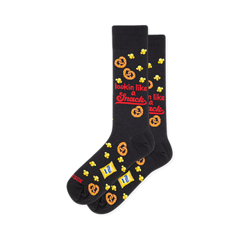 Black crew socks showing a pattern of pretzels, popcorn, snack bags, and red text reading lookin like a snack.