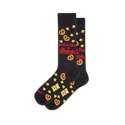Black crew socks showing a pattern of pretzels, popcorn, snack bags, and red text reading lookin like a snack.