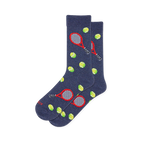 Heather navy blue socks featuring a pattern of red tennis rackets with dark handles and bright yellow-green tennis balls.