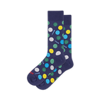 Navy blue crew socks covered in dimpled golf balls in white, yellow, green and blue, with small light blue golf tees.