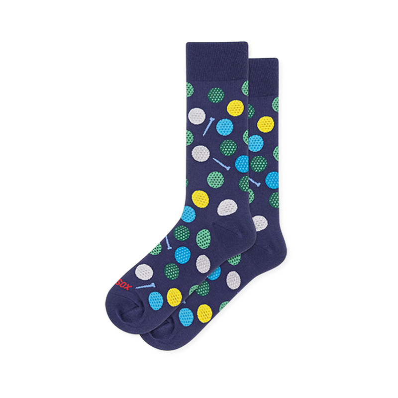 Navy blue crew socks covered in dimpled golf balls in white, yellow, green and blue, with small light blue golf tees.