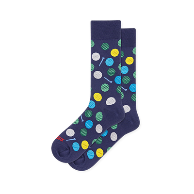 Navy blue crew socks covered in dimpled golf balls in white, yellow, green and blue, with small light blue golf tees.