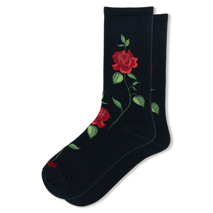 Black crew socks featuring a prominent pattern of large red roses with detailed green leaves and winding stems.
