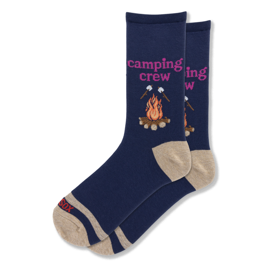 Navy blue crew socks featuring pink camping crew text, a campfire graphic, and roasting marshmallows with tan heel and toe.