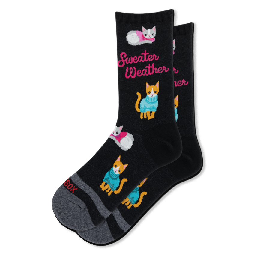 Black crew socks featuring orange and grey cats wearing pink and blue sweaters, with hot pink Sweater Weather text.
