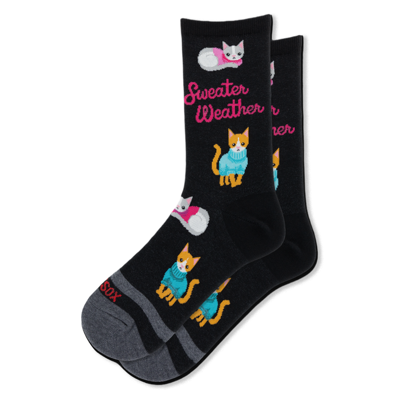 Black crew socks featuring orange and grey cats wearing pink and blue sweaters, with hot pink Sweater Weather text.