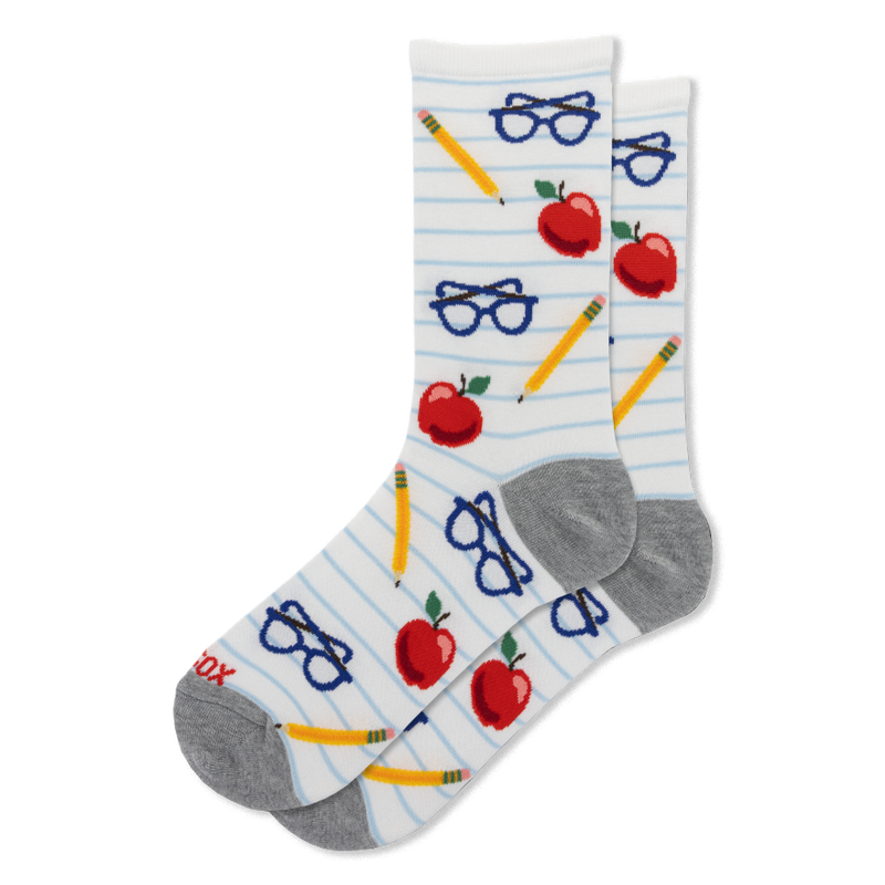 White socks with blue lined paper pattern showing red apples, yellow pencils, and blue eyeglasses. Gray heels and toes.