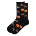 Black crew socks with a repeating pattern of bright orange pumpkins and brown acorns alongside scattered autumn leaves.