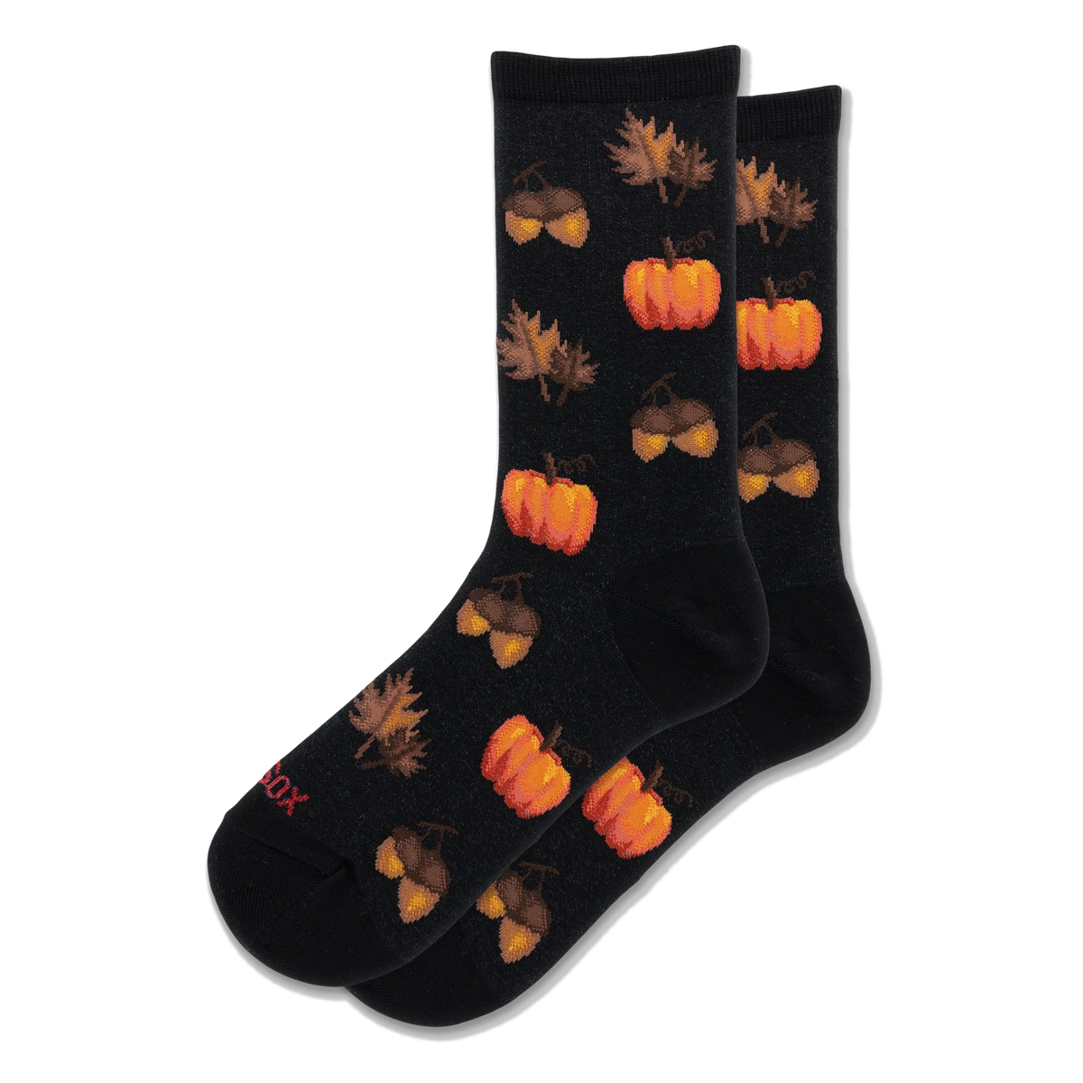 Black crew socks with a repeating pattern of bright orange pumpkins and brown acorns alongside scattered autumn leaves.