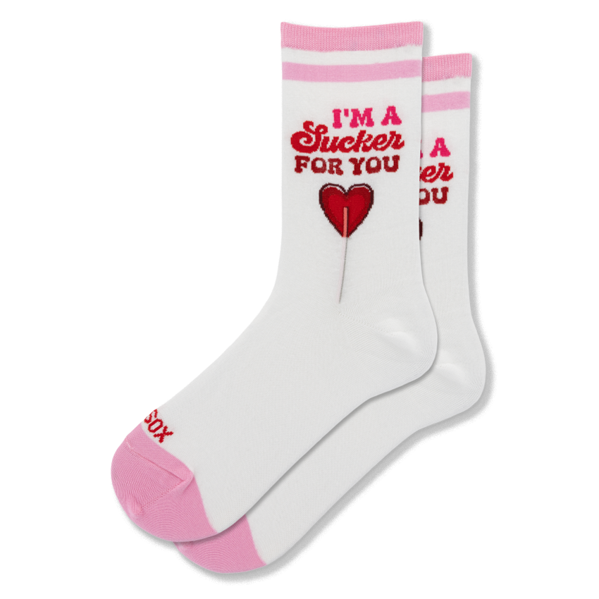 White crew socks with pink toes and stripes. The leg features the text I'M A Sucker FOR YOU above a red heart lollipop.