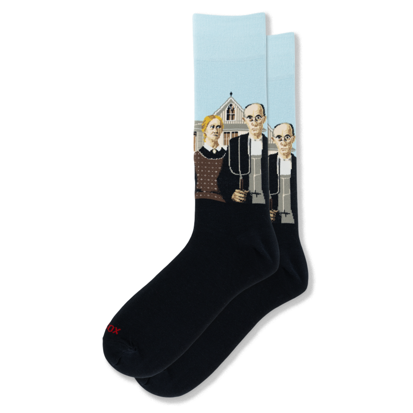 Black crew socks featuring the American Gothic painting on the ankle with the farmer, pitchfork, and a pale blue sky.