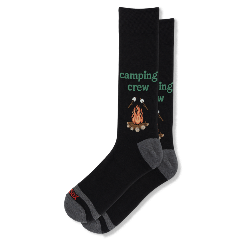 Black crew socks showing a campfire and roasting marshmallows. Green camping crew text sits above the flames. Grey heels.