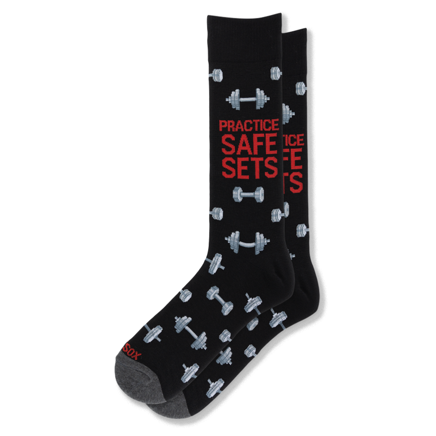 Black crew socks featuring grey dumbbells and bold red text reading PRACTICE SAFE SETS on the leg, with dark grey toes.