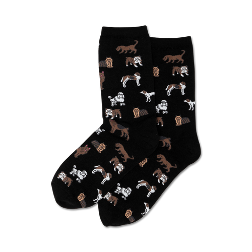 Pair of crew socks, black background, with a repeating pattern of various brown and white dogs.