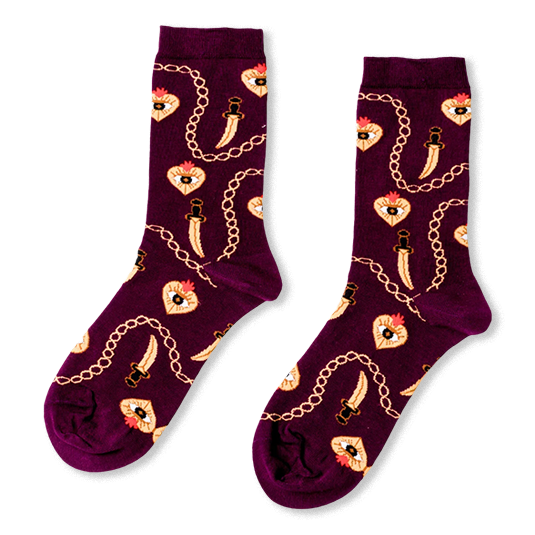 Burgundy crew socks showing a pattern of golden chains, curved daggers, and flaming hearts with an eye in the center.