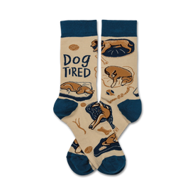beige crew socks with sleepy cartoon dog pattern, "dog tired" stitched in cursive, navy cuffs and toes.   