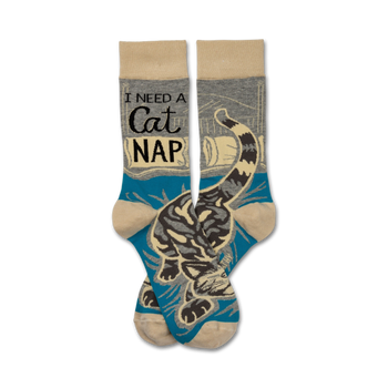 cat nap crew socks with â€œi need a cat napâ€ in large black text on blue background, cartoon cat sleeping on book  