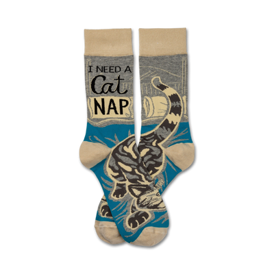 cat nap crew socks with â€œi need a cat napâ€ in large black text on blue background, cartoon cat sleeping on book  