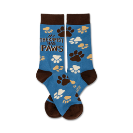 blue crew socks with brown toes, heels, and paw prints. text on front of socks reads my therapist has paws.  