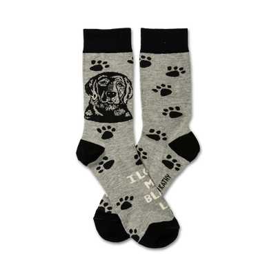 dog-themed socks in gray with black tops, toes, and paw prints. black dog heads on the front; "i love my black lab" on bottom. unisex, crew length.   