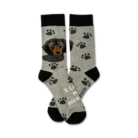 gray crew socks with black paw print pattern and dachshund on front. "i love my dachshund" text. for men and women. 