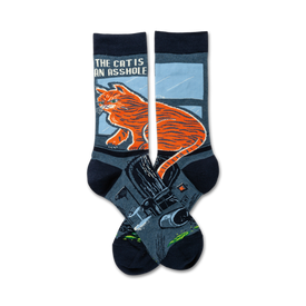 blue crew socks feature smug orange cat sitting on the toilet with, "the cat is an asshole" text. funny cat gift socks.  