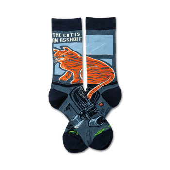blue crew socks feature smug orange cat sitting on the toilet with, "the cat is an asshole" text. funny cat gift socks.  