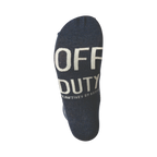 Close-up shot of the sole of a navy blue sock, showing the words 'OFF DUTY' in white text.