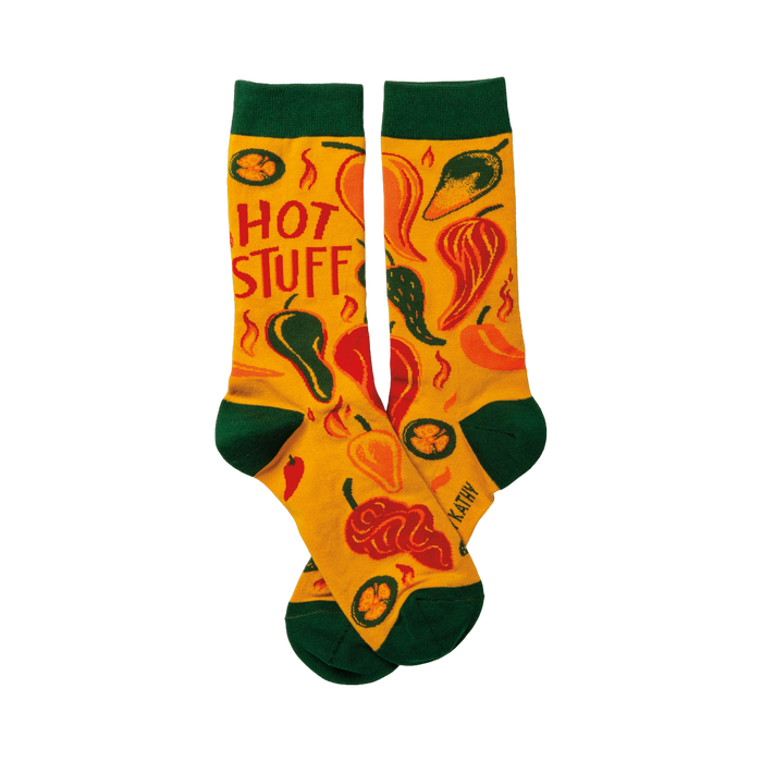 Crew socks in yellow with a chili pepper design and 'Hot Stuff' text.  Green cuffs add a nice contrast. }}