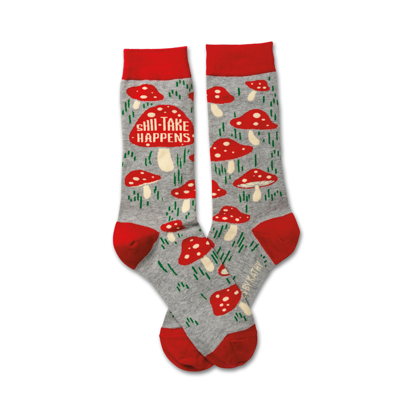 A pair of crew socks in grey with red mushroom designs and the text 'Shii-Take Happens'. Red cuffs.