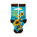 Pair of crew socks. Teal background with sunflowers, a sun, and the text 'Today is a good day'. Brown cuff.
