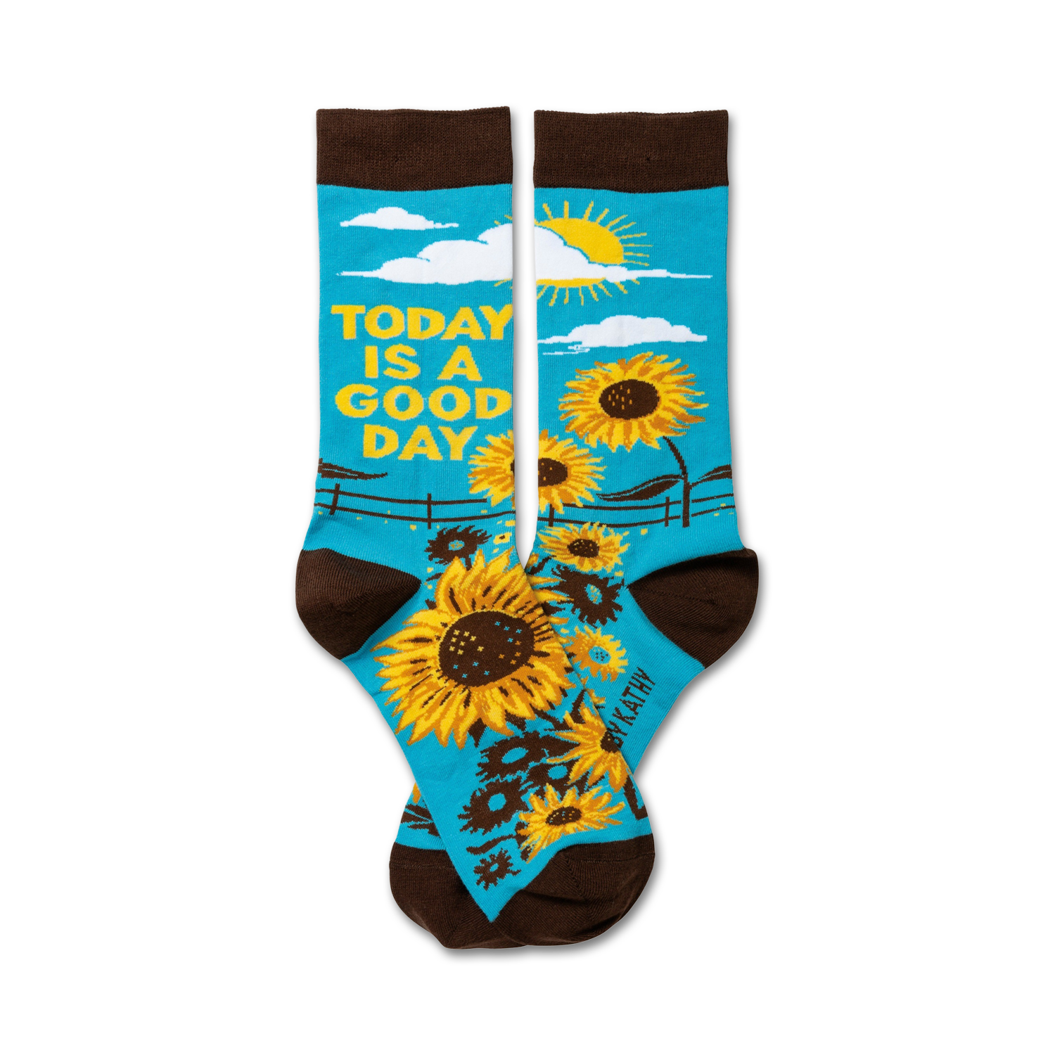 Pair of crew socks. Teal background with sunflowers, a sun, and the text 'Today is a good day'. Brown cuff.