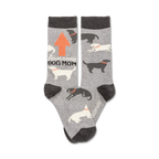 Gray crew socks with a repeating pattern of black and white dogs, an orange arrow, and the text 'Awesome Dog Mom'.