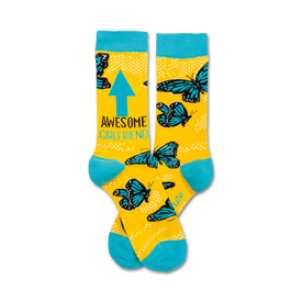 crew length yellow socks with blue toe, heel, and cuff feature "awesome girlfriend" text and a blue arrow pointing up along with scattered butterflies and polka dots.  