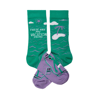 Crew socks in teal green and lavender purple.  Design includes a beach scene with a palm tree, sun, and a person surfing.
