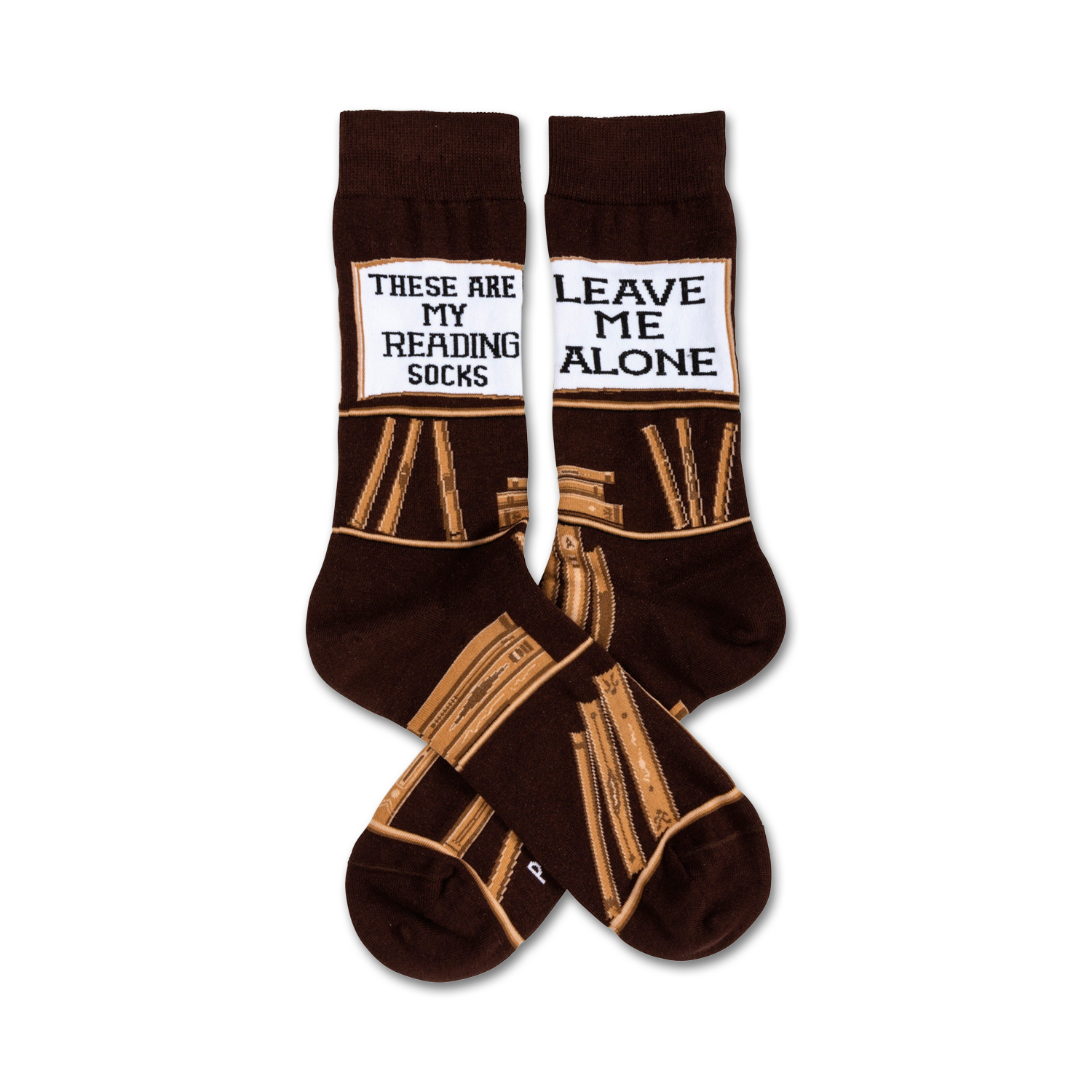 Pair of brown crew socks with a tan book stack design and a white label reading 'These Are My Reading Socks' and 'Leave Me Alone'.