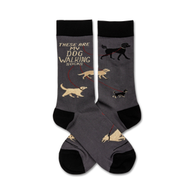 gray crew socks with black toes, heels & text that says 'these are my dog walking socks'. four cartoon dogs in black, brown, tan, and white being walked by a human are featured.  