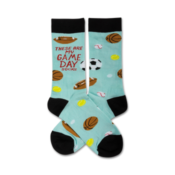 light blue crew socks with black toes and heels, red text "these are my game day socks", and various sports balls for men.  