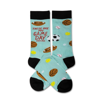 light blue crew socks with black toes and heels, red text "these are my game day socks", and various sports balls for men.  