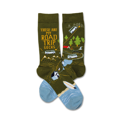 green crew socks with black text reading "these are my road trip socks," yellow car, van, tent, campfire, trees, mountains, and surfboard graphics.   